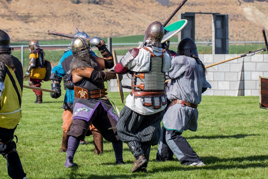 Four armored fighters are engaged in combat.